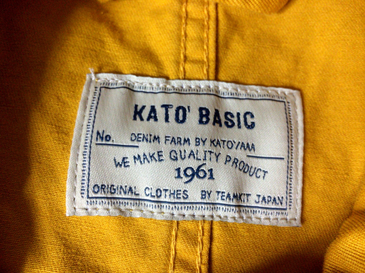 KATO`のステンカラーコートマスタード